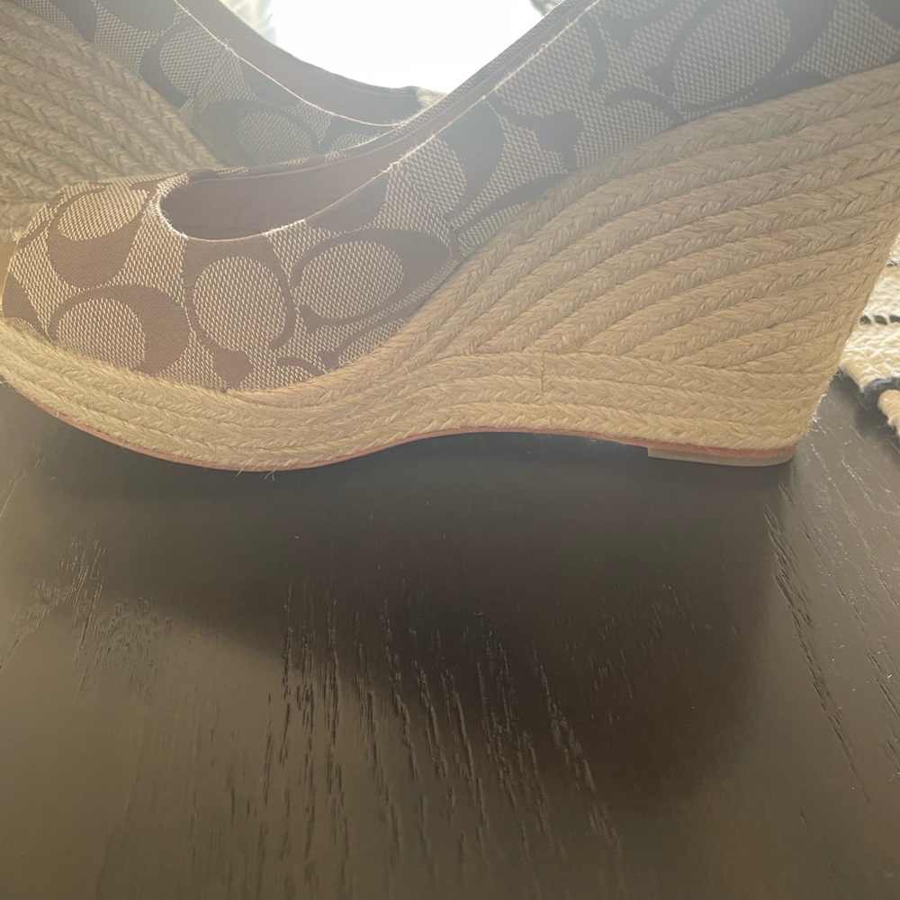 Coach peep toe wedge with gold peep toe trim and woven sides. Shoes worn less